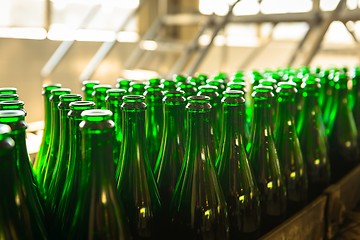 Image showing Many bottles on conveyor belt