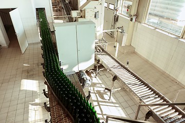 Image showing Many bottles on conveyor belt