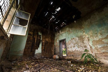 Image showing Dark room interior with damaged roof