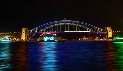 Image showing Vivid Sydney- boats cruise by Sydney Harbour Bridge in colour