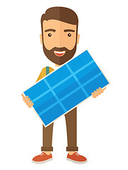 Image showing Man holding a solar panel.