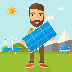 Image showing Man holding a solar panel.