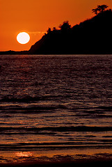 Image showing sun near a mountain in the ocean