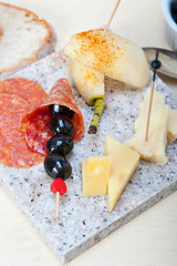 Image showing mix cold cut on a stone with fresh pears