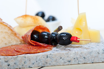 Image showing mix cold cut on a stone with fresh pears