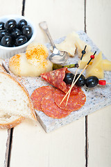 Image showing mix cold cut on a stone with fresh pears