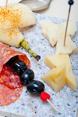 Image showing mix cold cut on a stone with fresh pears