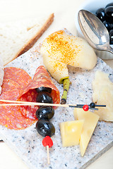 Image showing mix cold cut on a stone with fresh pears