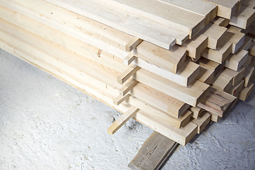 Image showing Lumber stacked at a construction site 