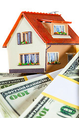 Image showing house on packs of banknotes