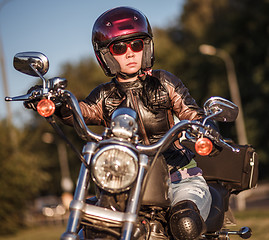 Image showing Biker girl on a motorcycle