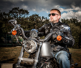 Image showing Biker on a motorcycle