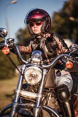 Image showing Biker girl on a motorcycle