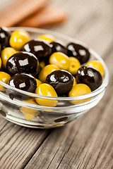 Image showing Olives on a wooden table