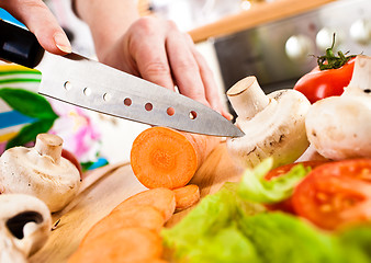 Image showing Woman\'s hands cutting vegetables