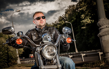 Image showing Biker on a motorcycle