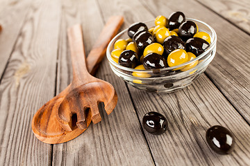 Image showing Olives on a wooden table