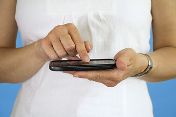 Image showing Young woman using cellphone