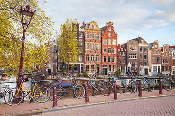 Image showing Bicycles parked on a bridge in Amsterdam