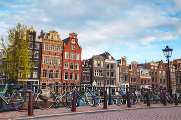 Image showing Bicycles parked on a bridge in Amsterdam