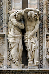 Image showing statues in  front of the dome of milan