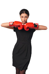 Image showing Serious business woman wearing boxing gloves