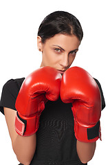 Image showing Serious business woman wearing boxing gloves