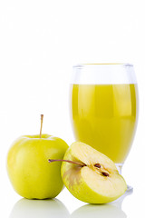 Image showing Apple juice in glass and green apples