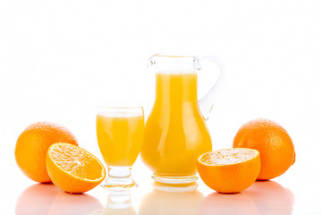 Image showing Orange juice in pitcher and oranges 