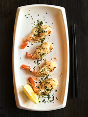 Image showing White plate with grilled shrimps