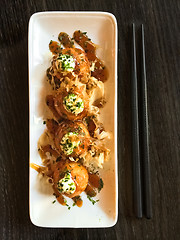 Image showing Creamy octopus balls on white plate