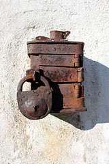 Image showing Antique moneybox with padlock intended for helping poor people 