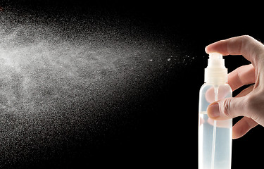 Image showing spray bottle photographed while spraying