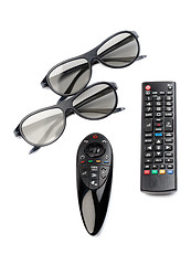 Image showing Two pairs of 3D glasses and remote control TV