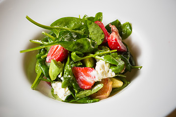 Image showing Fresh Salad with strawberries, goat cheese and shrimps