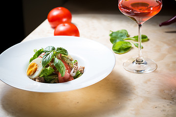 Image showing plate of spring mix salad with strawberry, eggs and tuna