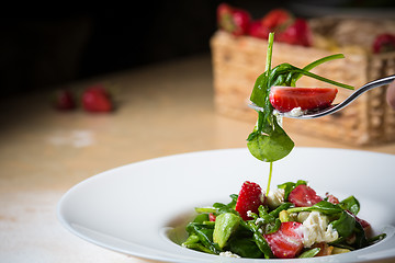 Image showing Fresh Salad with strawberries, goat cheese and shrimps