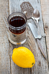Image showing Black tea in glass and lemon.