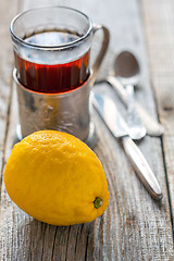 Image showing Lemon and glass of tea.