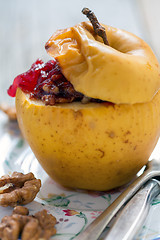 Image showing Baked apple with nuts and berries.