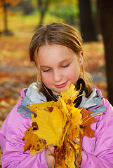 Image showing Girl with leaves