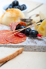 Image showing mix cold cut on a stone with fresh pears