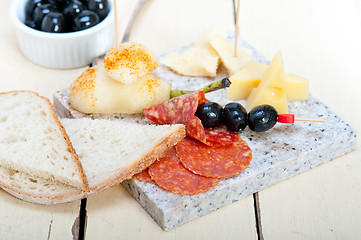 Image showing mix cold cut on a stone with fresh pears