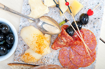 Image showing mix cold cut on a stone with fresh pears