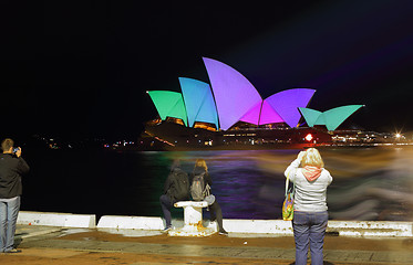 Image showing Tourists brave the rain on Opening Night Vivid Sydney