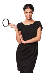 Image showing Business woman holding a magnifying glass