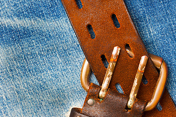 Image showing unfastened old leather belt with vintage buckles