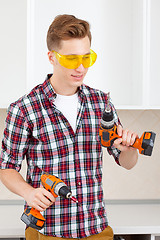 Image showing worker with drill