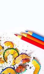 Image showing three colored pencils and shavings