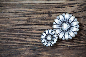 Image showing metal vintage buttons in flower image